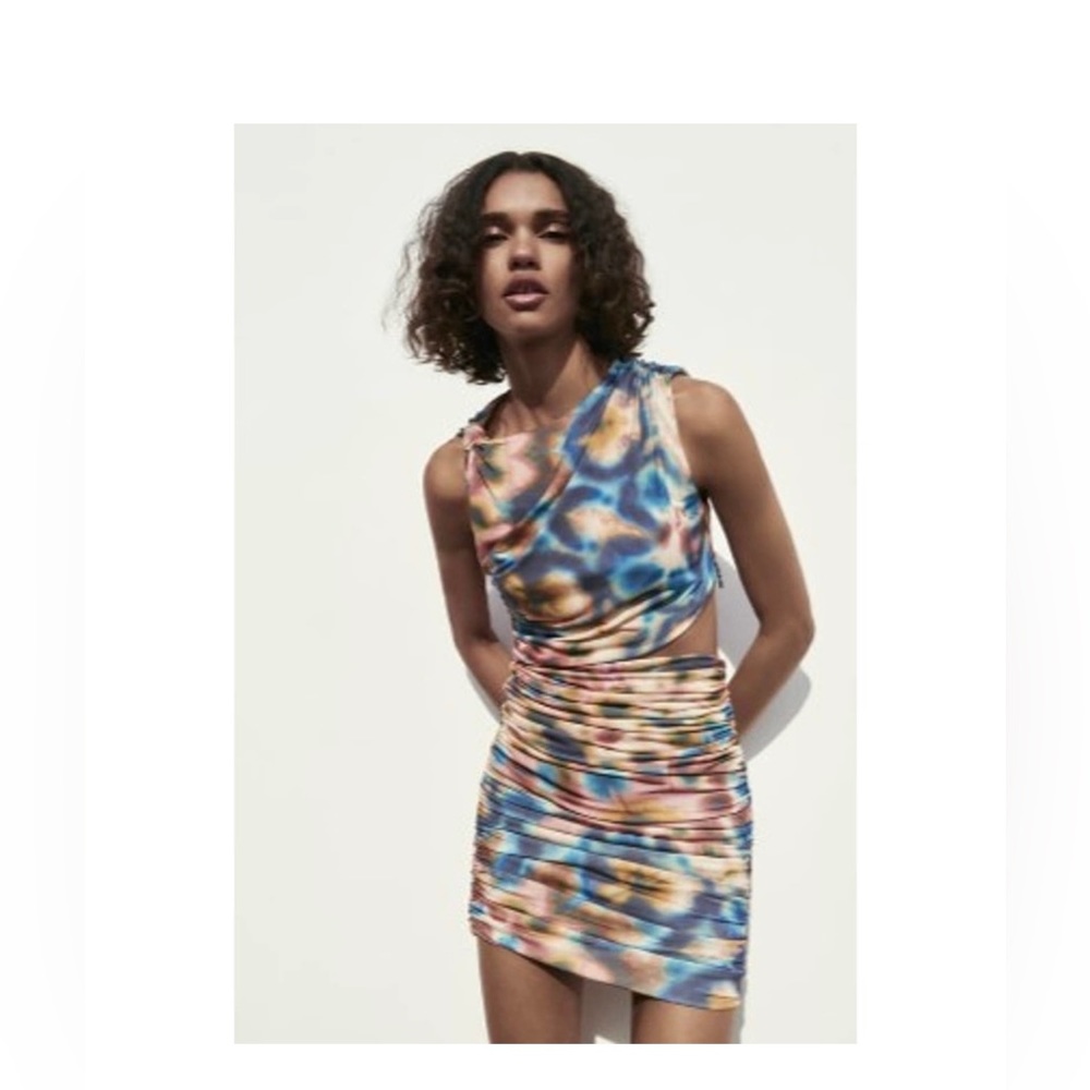 Beautiful water color dress. peek a boo side belly cut.
